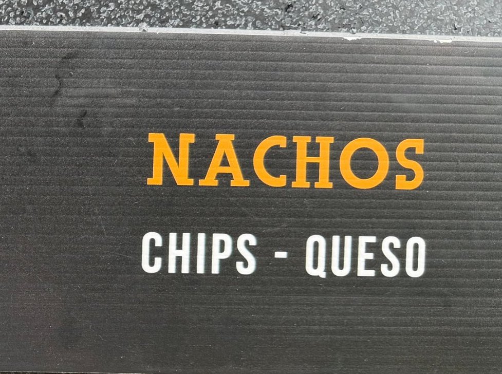 Menu sign: Nachos — chips, queso